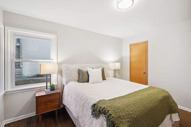 2512 27th Ave NE, Saint Anthony, MN 55418 - bedroom with baseboards and dark wood-style flooring