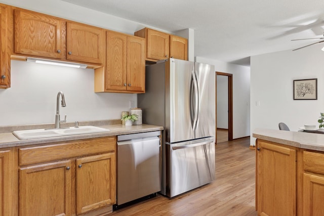 11124 Welcome Ave N, Champlin, MN 55316 - kitchen featuring stainless steel appliances, a sink, a ceiling fan, and light countertops