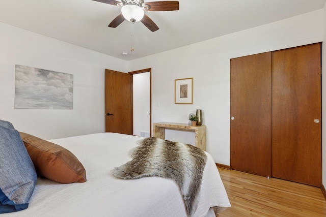 11124 Welcome Ave N, Champlin, MN 55316 - bedroom featuring light wood-style flooring, a closet, and a ceiling fan