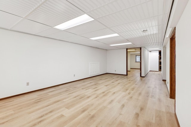 11124 Welcome Ave N, Champlin, MN 55316 - spare room featuring light wood-style flooring and baseboards