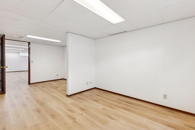 11124 Welcome Ave N, Champlin, MN 55316 - spare room featuring light wood-type flooring, baseboards, and a drop ceiling