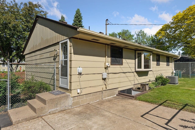11124 Welcome Ave N, Champlin, MN 55316 - view of side of home featuring a patio area and central air condition unit