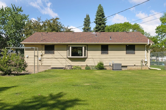 11124 Welcome Ave N, Champlin, MN 55316 - back of house with central AC and a shingled roof