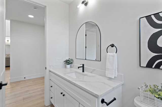 2520 230th Ct NW, Saint Francis, MN 55070 - bathroom with vanity, wood finished floors, baseboards, and recessed lighting