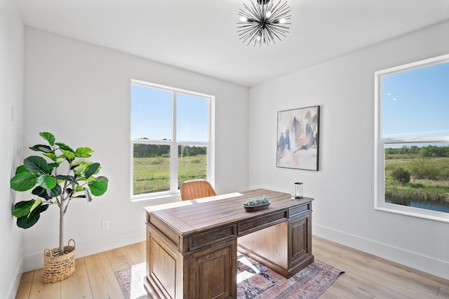 2520 230th Ct NW, Saint Francis, MN 55070 - office area featuring light wood-type flooring, a chandelier, and baseboards