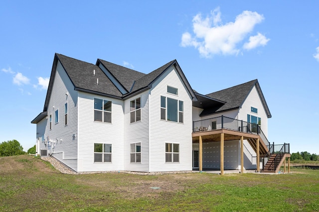 2520 230th Ct NW, Saint Francis, MN 55070 - back of house with stairway, a wooden deck, a shingled roof, and a lawn