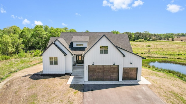2520 230th Ct NW, Saint Francis, MN 55070 - modern farmhouse featuring board and batten siding, roof with shingles, and driveway