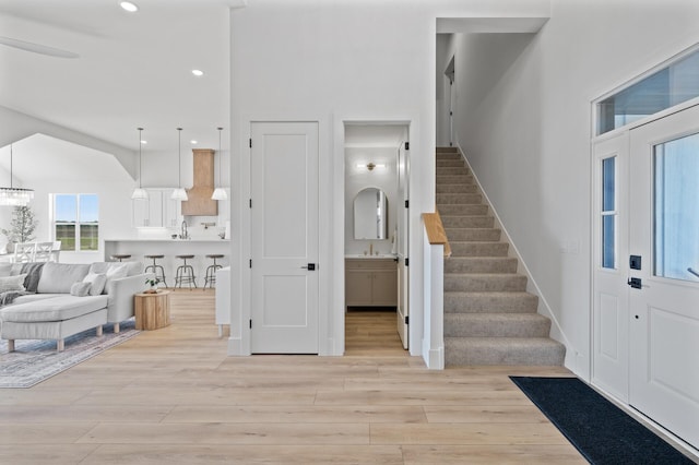 2520 230th Ct NW, Saint Francis, MN 55070 - entryway featuring stairs, light wood finished floors, recessed lighting, and a towering ceiling
