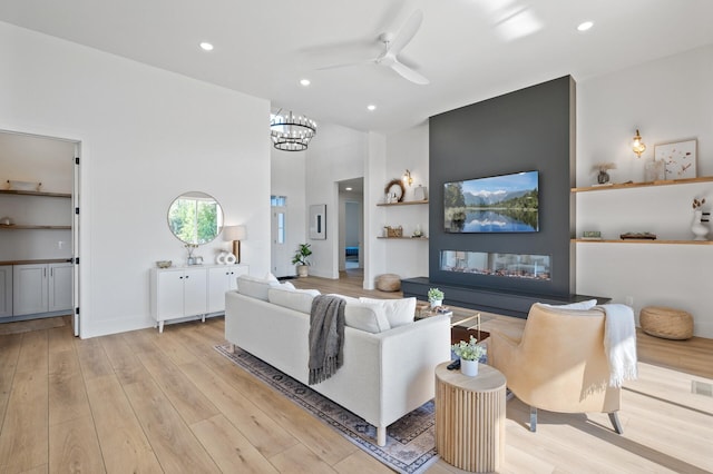 2520 230th Ct NW, Saint Francis, MN 55070 - living area featuring a ceiling fan, recessed lighting, a high ceiling, light wood-style floors, and a chandelier