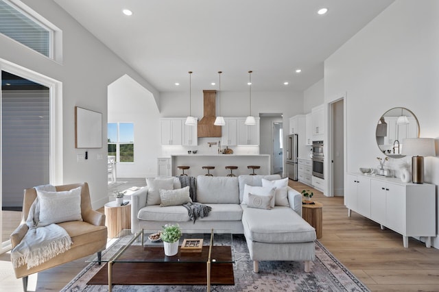 2520 230th Ct NW, Saint Francis, MN 55070 - living room featuring light wood-style floors, recessed lighting, and a towering ceiling