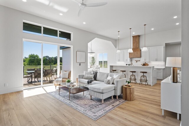 2520 230th Ct NW, Saint Francis, MN 55070 - living area with a towering ceiling, recessed lighting, light wood-style floors, plenty of natural light, and ceiling fan