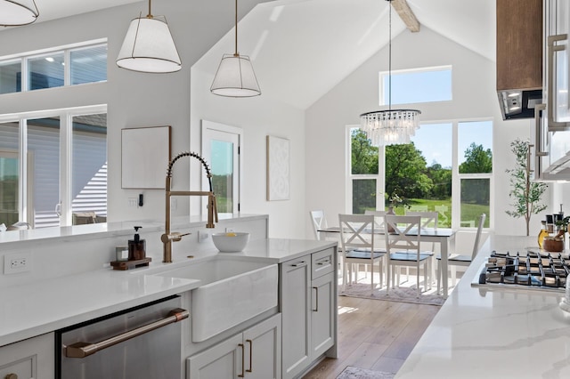 2520 230th Ct NW, Saint Francis, MN 55070 - kitchen featuring stainless steel appliances, high vaulted ceiling, beamed ceiling, a sink, and light wood finished floors