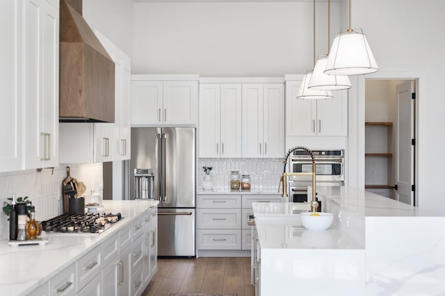 2520 230th Ct NW, Saint Francis, MN 55070 - kitchen with stainless steel appliances, decorative backsplash, white cabinets, and wall chimney range hood