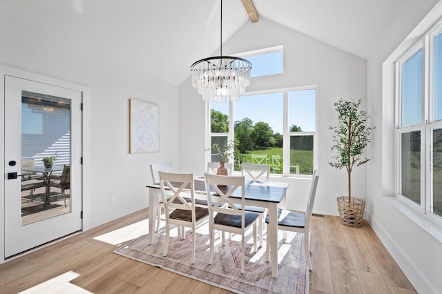 2520 230th Ct NW, Saint Francis, MN 55070 - dining space with beam ceiling, a chandelier, light wood finished floors, baseboards, and high vaulted ceiling