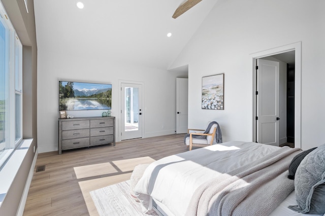 2520 230th Ct NW, Saint Francis, MN 55070 - bedroom with high vaulted ceiling, access to exterior, recessed lighting, light wood-type flooring, and baseboards