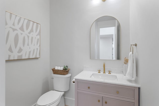 2520 230th Ct NW, Saint Francis, MN 55070 - bathroom featuring toilet, vanity, and baseboards