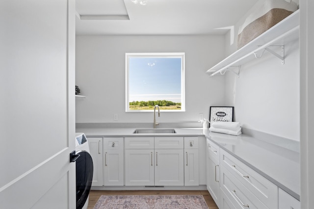 2520 230th Ct NW, Saint Francis, MN 55070 - laundry room with cabinet space and washer / dryer