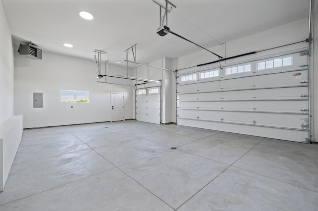 2520 230th Ct NW, Saint Francis, MN 55070 - garage with a garage door opener, electric panel, recessed lighting, and a heating unit
