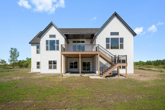 2520 230th Ct NW, Saint Francis, MN 55070 - back of house with stairway, a lawn, a shingled roof, and a deck