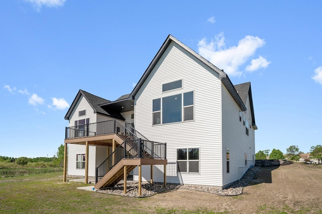 2520 230th Ct NW, Saint Francis, MN 55070 - rear view of house with stairs, a deck, a shingled roof, and a lawn