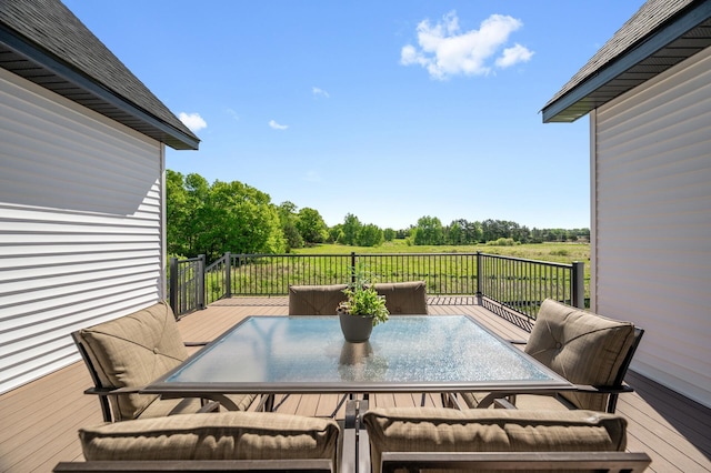 2520 230th Ct NW, Saint Francis, MN 55070 - wooden terrace with outdoor dining space and view of scattered trees