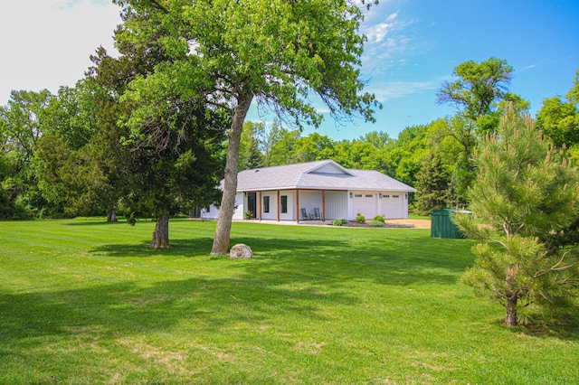 850 60th Ave SW, Benson, MN 56231 - view of grassy yard with an attached garage and driveway