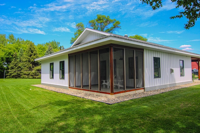 850 60th Ave SW, Benson, MN 56231 - rear view of house featuring a sunroom and a yard