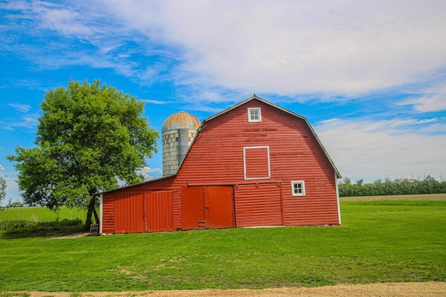 850 60th Ave SW, Benson, MN 56231 - view of property exterior with a barn, a garage, a yard, and an outdoor structure