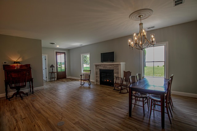 850 60th Ave SW, Benson, MN 56231 - dining area with baseboards, a stone fireplace, dark wood-style flooring, and recessed lighting