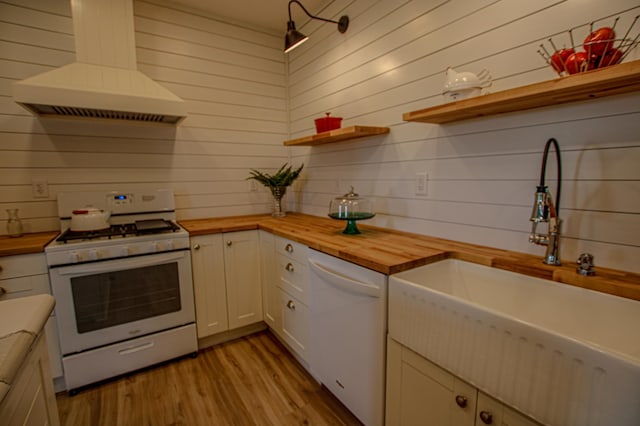 850 60th Ave SW, Benson, MN 56231 - kitchen featuring wooden counters, white appliances, a sink, premium range hood, and wooden walls