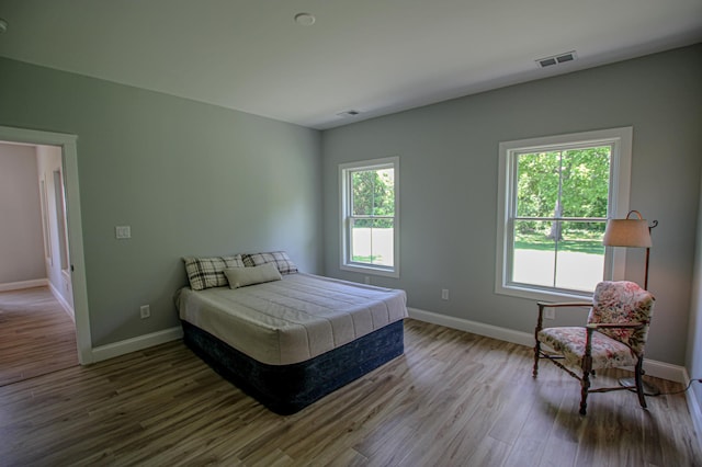850 60th Ave SW, Benson, MN 56231 - bedroom featuring baseboards and wood finished floors