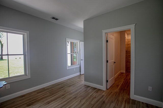 850 60th Ave SW, Benson, MN 56231 - unfurnished bedroom featuring wood finished floors and baseboards