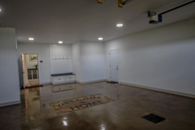 850 60th Ave SW, Benson, MN 56231 - garage featuring recessed lighting, baseboards, and a garage door opener