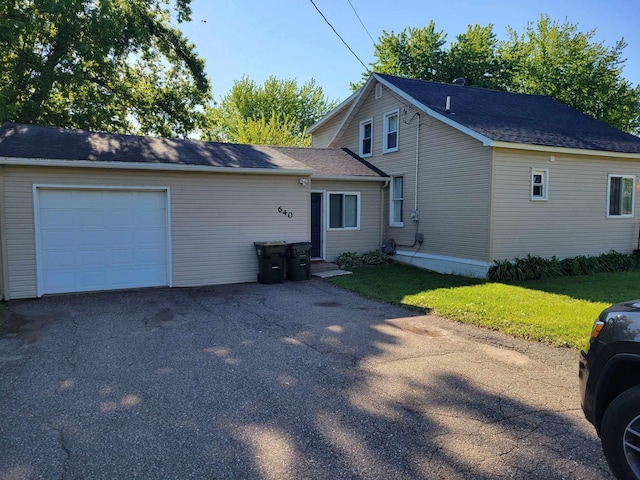 640 6th St, Albany, MN 56307 - view of front of home featuring a garage, asphalt driveway, and a front yard