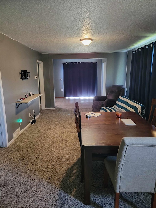 640 6th St, Albany, MN 56307 - carpeted dining room with baseboards and a textured ceiling