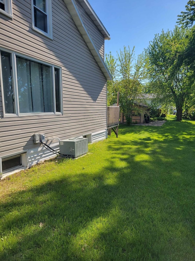 640 6th St, Albany, MN 56307 - view of property exterior featuring central air condition unit and a lawn