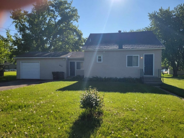 640 6th St, Albany, MN 56307 - view of front of home featuring a garage, asphalt driveway, a front lawn, and entry steps