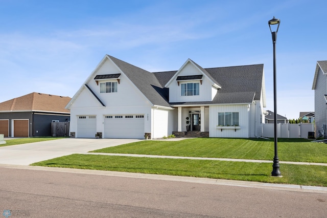 2652 70th Ave S, Fargo, ND 58104 - modern inspired farmhouse with driveway, an attached garage, and board and batten siding
