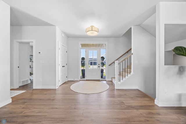 2652 70th Ave S, Fargo, ND 58104 - foyer featuring wood finished floors, baseboards, and stairs
