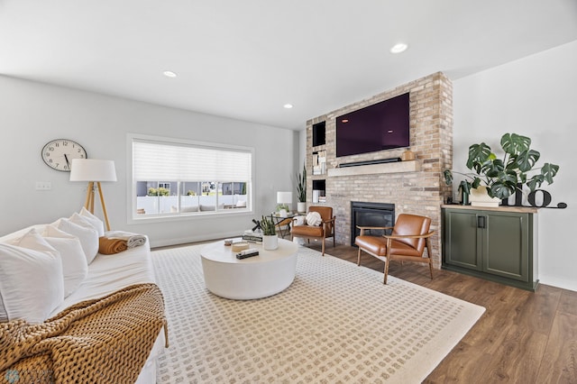 2652 70th Ave S, Fargo, ND 58104 - living room with a fireplace, wood finished floors, baseboards, and recessed lighting