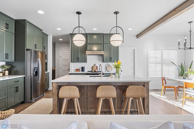 2652 70th Ave S, Fargo, ND 58104 - kitchen featuring stainless steel fridge, green cabinets, dark wood-style flooring, recessed lighting, and beam ceiling