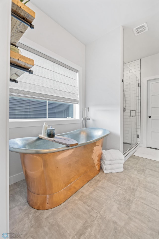 2652 70th Ave S, Fargo, ND 58104 - bathroom with a shower stall and a soaking tub