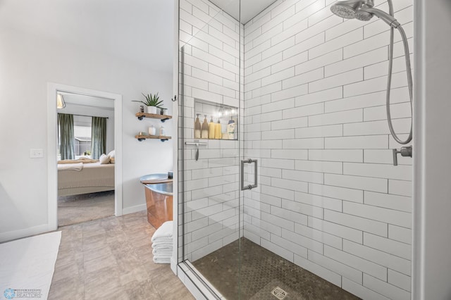 2652 70th Ave S, Fargo, ND 58104 - ensuite bathroom featuring a stall shower and baseboards