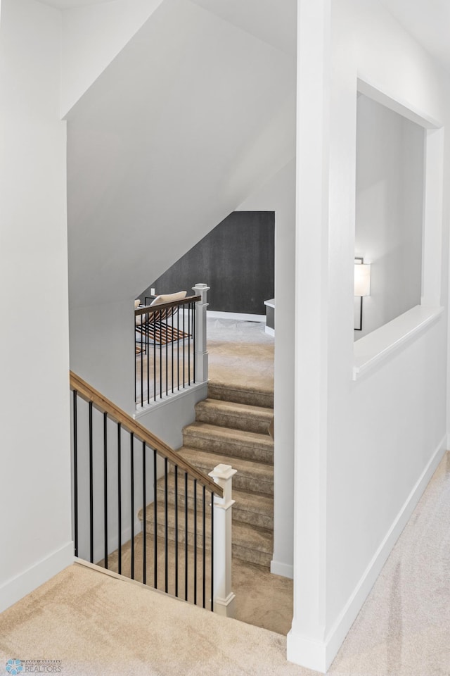 2652 70th Ave S, Fargo, ND 58104 - staircase with carpet, vaulted ceiling, and baseboards