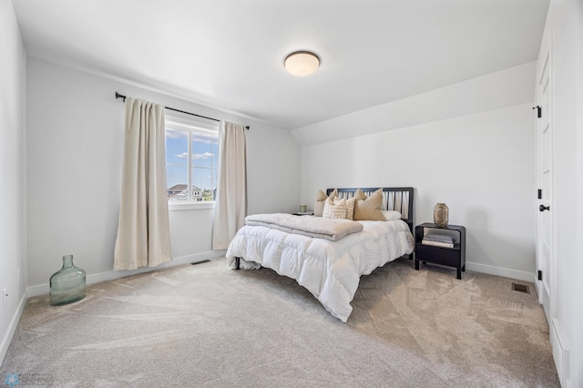 2652 70th Ave S, Fargo, ND 58104 - bedroom featuring carpet floors, baseboards, and vaulted ceiling
