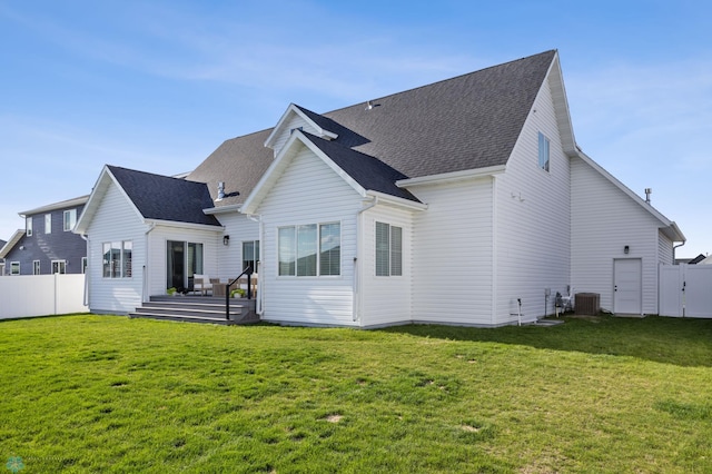 2652 70th Ave S, Fargo, ND 58104 - rear view of house with cooling unit, a shingled roof, and a wooden deck