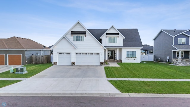2652 70th Ave S, Fargo, ND 58104 - modern inspired farmhouse featuring concrete driveway, a garage, and board and batten siding