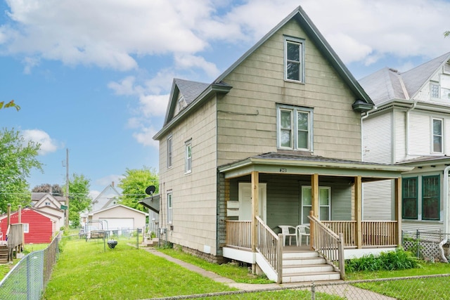 310 Burgess St, Saint Paul, MN 55117 - view of front of home with covered porch and a detached garage