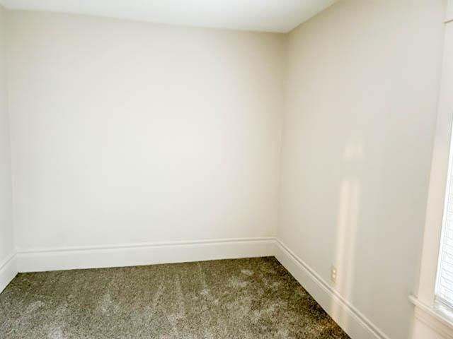 310 Burgess St, Saint Paul, MN 55117 - carpeted empty room featuring baseboards