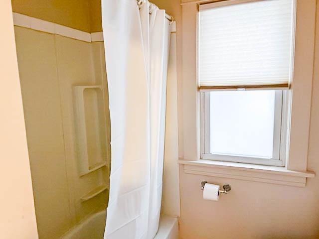 310 Burgess St, Saint Paul, MN 55117 - full bath featuring shower / bath combination with curtain
